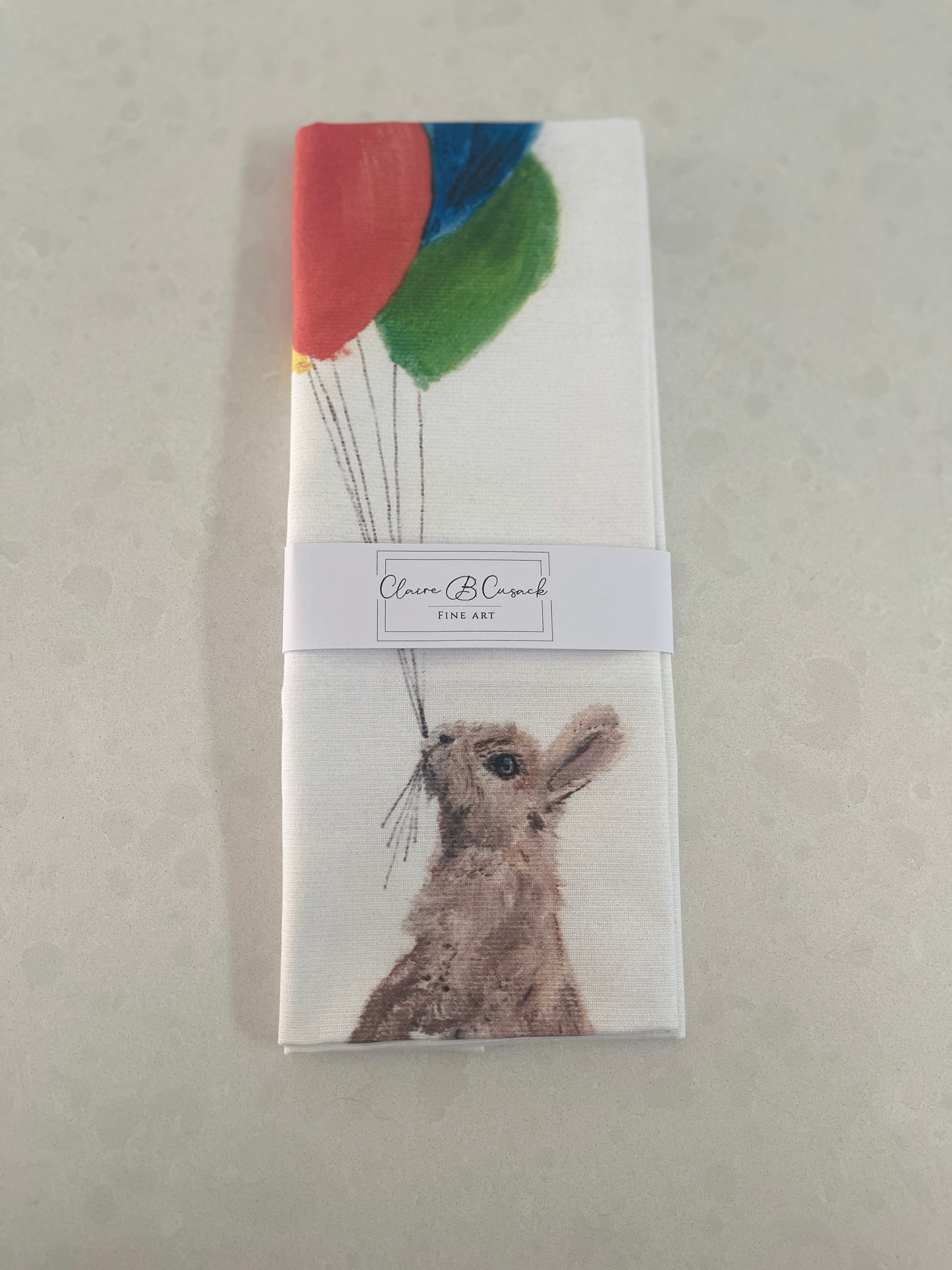 Brown Bunny Hanging from Balloons Tea Towel