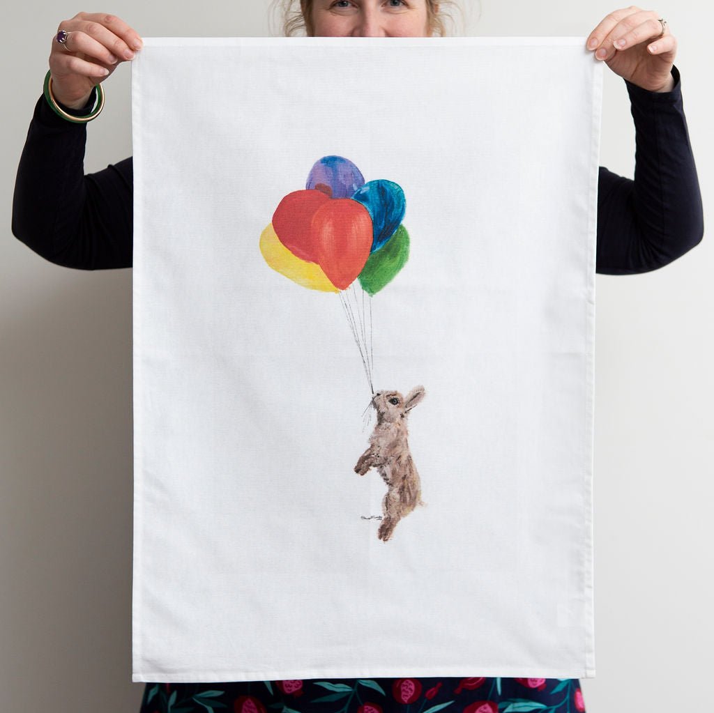 Brown Bunny Hanging from Balloons Tea Towel