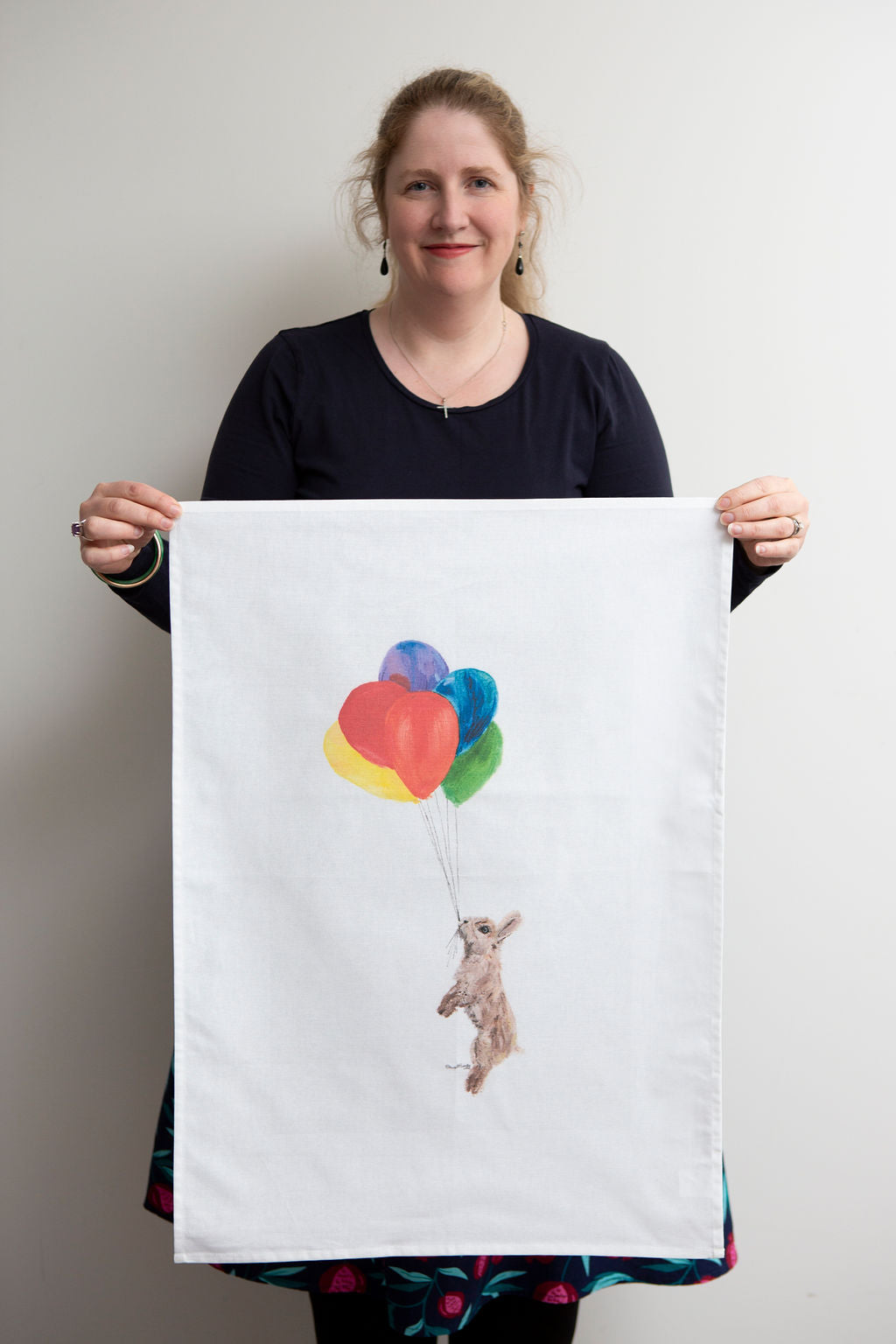 Brown Bunny Hanging from Balloons Tea Towel