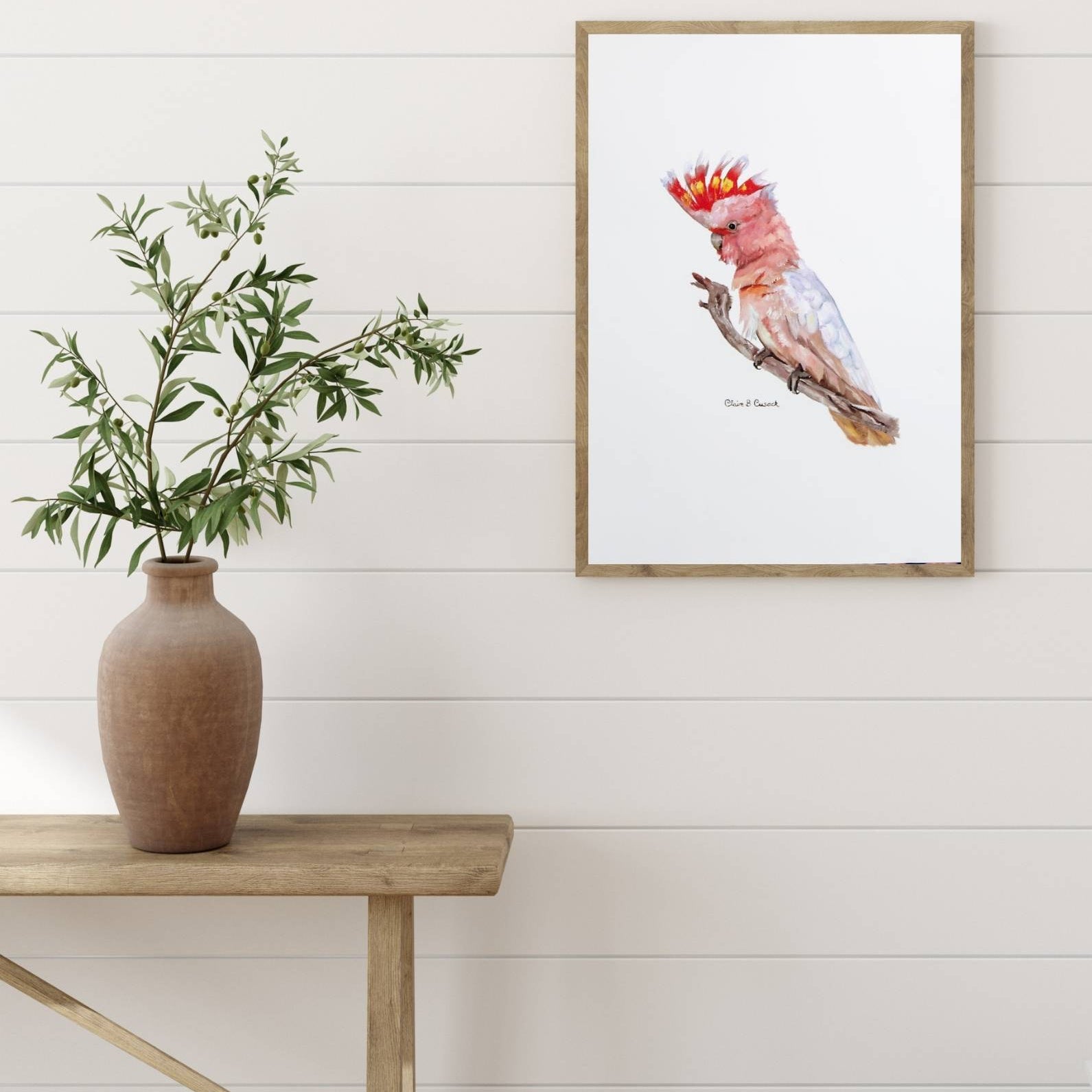 family room with framed example of australian pink cockatoo on branch